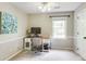 Bright bedroom with a desk area, a chair, and a window at 3707 Dunwoody Club Dr, Atlanta, GA 30350
