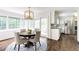 Charming dining area with a modern light fixture and view of the kitchen at 3707 Dunwoody Club Dr, Atlanta, GA 30350