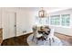 Sunlit dining area with stylish chairs, rug, and views of the outdoors at 3707 Dunwoody Club Dr, Atlanta, GA 30350