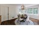Bright dining area with hardwood floors, round table, and sun-filled windows at 3707 Dunwoody Club Dr, Atlanta, GA 30350
