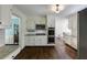 Modern kitchen with white cabinets, stainless steel appliances, granite countertops, and open access to dining area at 3707 Dunwoody Club Dr, Atlanta, GA 30350