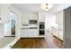Bright kitchen with white cabinets, granite counters, stainless steel appliances, and hardwood floors at 3707 Dunwoody Club Dr, Atlanta, GA 30350