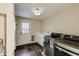 Functional laundry room with modern washer and dryer, sink, and ample storage at 3707 Dunwoody Club Dr, Atlanta, GA 30350