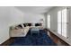 Comfortable sitting room with shutters, a plush sectional, and stylish decor at 3707 Dunwoody Club Dr, Atlanta, GA 30350