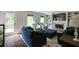 Cozy living room features a fireplace, built-in bookshelves, and plush seating at 3707 Dunwoody Club Dr, Atlanta, GA 30350