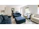 Open-concept living room with ample seating and natural light at 3707 Dunwoody Club Dr, Atlanta, GA 30350