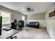 Large living room with plush carpet, bright windows, a ceiling fan, and comfortable seating at 3707 Dunwoody Club Dr, Atlanta, GA 30350