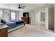 Spacious main bedroom with a ceiling fan and a view into the ensuite bath area at 3707 Dunwoody Club Dr, Atlanta, GA 30350
