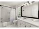 Well-lit bathroom with a shower-tub combination and single sink vanity at 5120 Falcon Chase Ln, Atlanta, GA 30342