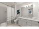 Bright bathroom featuring a shower-tub combination and vanity with generous counter space at 5120 Falcon Chase Ln, Atlanta, GA 30342