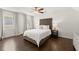 Bedroom with two windows that allow abundant natural light and a king bed at 5120 Falcon Chase Ln, Atlanta, GA 30342