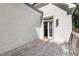 Back of house showing exterior door and a wooden deck attached to the building at 5120 Falcon Chase Ln, Atlanta, GA 30342