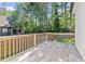 Inviting wooden deck providing a view of the private, tree-lined backyard at 5120 Falcon Chase Ln, Atlanta, GA 30342