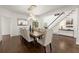 Bright dining room features hardwood floors, staircase, and a modern chandelier at 5120 Falcon Chase Ln, Atlanta, GA 30342