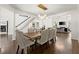 Elegant dining room boasts hardwood floors, wainscoting, and a modern chandelier at 5120 Falcon Chase Ln, Atlanta, GA 30342