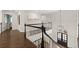 Grand foyer with hardwood floors, elegant staircase, and natural lighting at 5120 Falcon Chase Ln, Atlanta, GA 30342