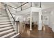 Entry hall offers a view into the formal dining room and a staircase leading to the second floor at 5120 Falcon Chase Ln, Atlanta, GA 30342