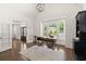 Spacious home office with hardwood floors, built-in shelving, fireplace, and large windows at 5120 Falcon Chase Ln, Atlanta, GA 30342