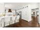 Spacious kitchen with white cabinets, large island, stainless steel appliances, and hardwood floors at 5120 Falcon Chase Ln, Atlanta, GA 30342
