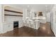 Beautiful kitchen featuring white cabinets, a center island, and a wine bar at 5120 Falcon Chase Ln, Atlanta, GA 30342