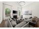 Living room featuring vaulted ceilings, fireplace, and large windows at 5120 Falcon Chase Ln, Atlanta, GA 30342