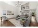Open-concept living room featuring hardwood floors, a fireplace, and soaring ceilings at 5120 Falcon Chase Ln, Atlanta, GA 30342