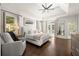 Bright main bedroom features a trey ceiling, hardwood floors, and private balcony access at 5120 Falcon Chase Ln, Atlanta, GA 30342