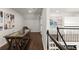 Spacious office with dark wood floors, large artwork, and staircase access at 5120 Falcon Chase Ln, Atlanta, GA 30342