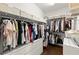Organized walk-in closet with built-in shelving and hanging racks at 5120 Falcon Chase Ln, Atlanta, GA 30342