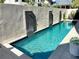 Stunning backyard pool featuring modern waterfalls and ample space for relaxation and entertaining friends at 11260 Serenbe Ln, Chattahoochee Hills, GA 30268