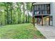 Backyard view with screened porch above the patio, and steps from grade to the porch at 315 N Fayette Dr, Fayetteville, GA 30214