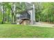 Exterior of home showing a large backyard, screened porch, and fresh exterior paint at 315 N Fayette Dr, Fayetteville, GA 30214