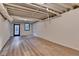 Unfinished basement with concrete flooring, exposed ceiling, and access to the exterior at 315 N Fayette Dr, Fayetteville, GA 30214