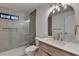 Bright bathroom featuring modern shower with a view to the sink and mirror at 315 N Fayette Dr, Fayetteville, GA 30214