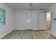 Bright bedroom featuring gray flooring, a closet, a window, and a view into the hall at 315 N Fayette Dr, Fayetteville, GA 30214