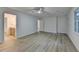 Large primary bedroom boasts hardwood floors, large windows and attached bathroom at 315 N Fayette Dr, Fayetteville, GA 30214
