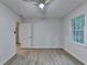 Bedroom features gray flooring, a ceiling fan, and a closet, offering a cozy and functional space at 315 N Fayette Dr, Fayetteville, GA 30214