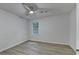 Bright bedroom with a ceiling fan and wood-look flooring at 315 N Fayette Dr, Fayetteville, GA 30214