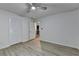 Bedroom featuring gray flooring, a ceiling fan, closet, and view into the hall at 315 N Fayette Dr, Fayetteville, GA 30214