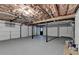 Spacious garage with epoxy floor, featuring an exposed rafter ceiling at 315 N Fayette Dr, Fayetteville, GA 30214