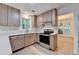 Modern kitchen featuring stainless steel appliances, sleek countertops, and stylish cabinetry at 315 N Fayette Dr, Fayetteville, GA 30214