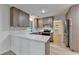 Well-designed kitchen features stainless steel appliances and a breakfast bar at 315 N Fayette Dr, Fayetteville, GA 30214