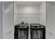 Convenient laundry room featuring modern black washer and dryer units and storage at 315 N Fayette Dr, Fayetteville, GA 30214