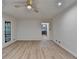 Bright living room with hardwood floors, a ceiling fan, and plenty of natural light at 315 N Fayette Dr, Fayetteville, GA 30214