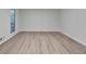 Bright living room featuring a large window and light wood floors at 315 N Fayette Dr, Fayetteville, GA 30214