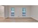 Bright living room with neutral walls, wood-look floors and natural light at 315 N Fayette Dr, Fayetteville, GA 30214