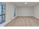 Bright living room with neutral walls, wood-look floors, and large windows at 315 N Fayette Dr, Fayetteville, GA 30214