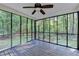 Screened-in porch with wood flooring, offering views of the surrounding trees at 315 N Fayette Dr, Fayetteville, GA 30214