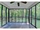 Inviting screened porch with forest views, perfect for enjoying nature and the outdoors at 315 N Fayette Dr, Fayetteville, GA 30214