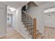 A freshly painted staircase with wooden treads and modern black iron railings at 315 N Fayette Dr, Fayetteville, GA 30214